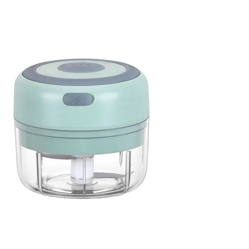 Small kitchen chopper with a light blue top and clear base on a white background