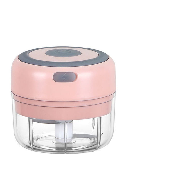 Pink and clear handheld chopper on a white background