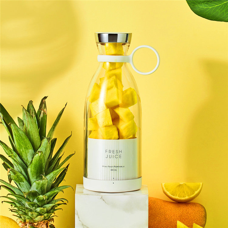 Clear bottle with yellow fruit pieces on a yellow background